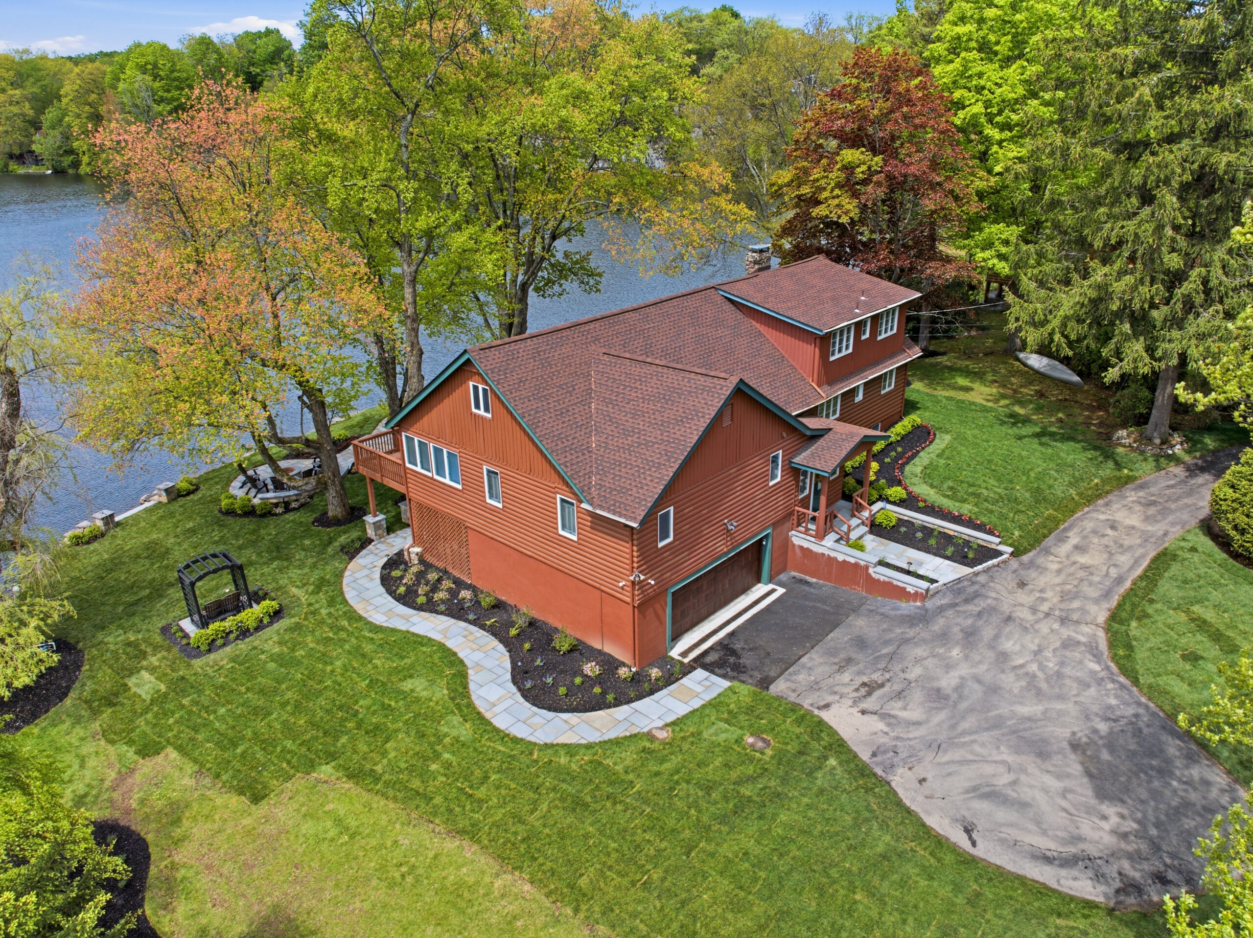 Aerial view showing front drive and landscaping