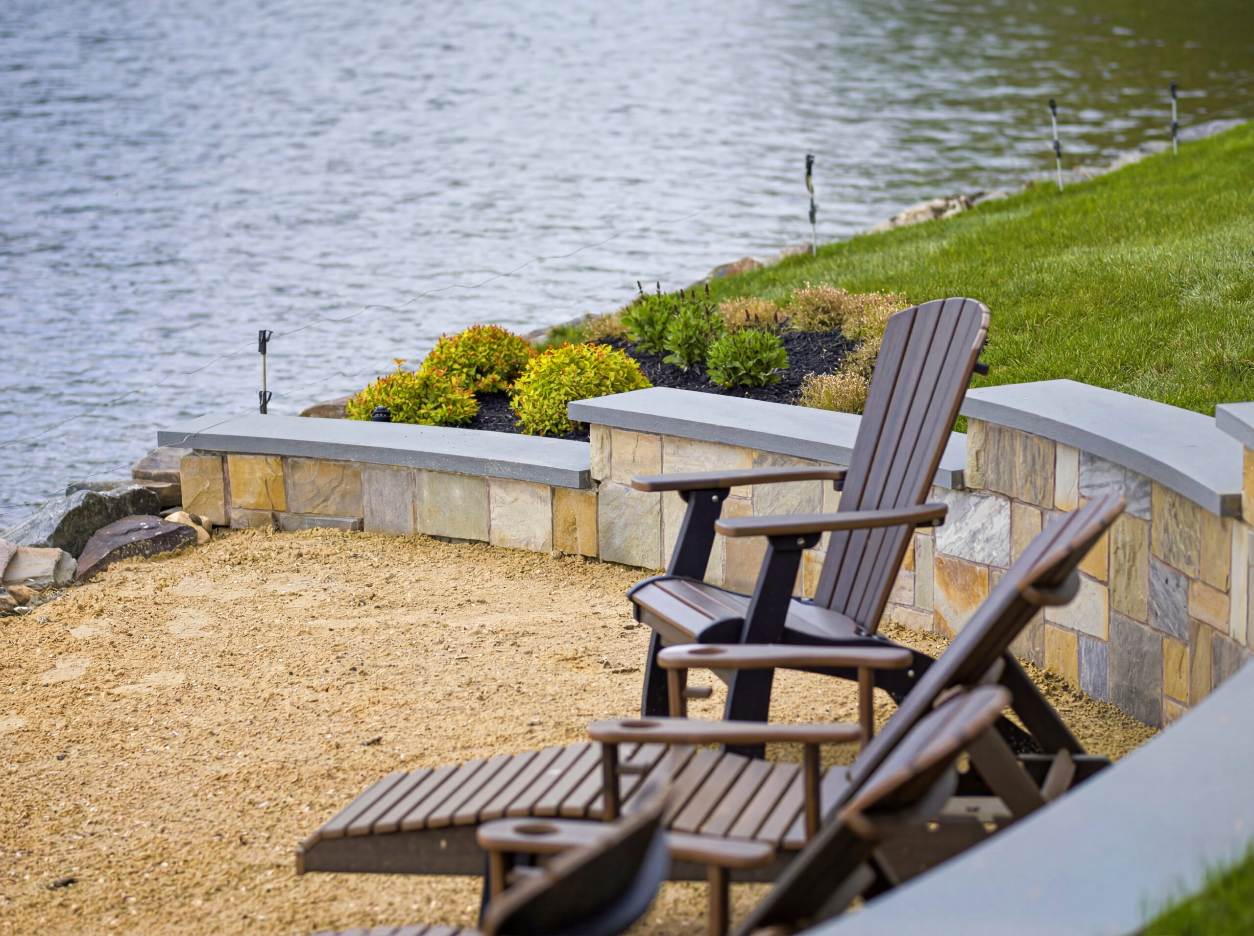 Beach seating area with stone retaining wall